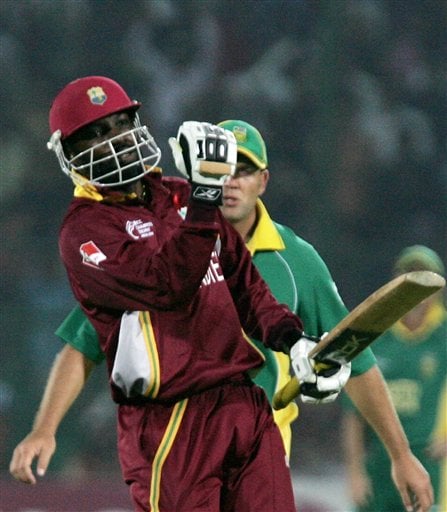West Indies' batsman Chris Gayle punches the air after completing his century against South Africa in the second semi-final of the ICC Trophy cricket tournament in Jaipur ICC CT WI-SA