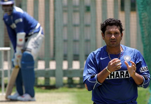 India's cricket player Sachin Tendulkar, right, walks way as is teammate Anil Kumble, left, looks on during the team practice in Benoni, South Africa. India gears up for SA