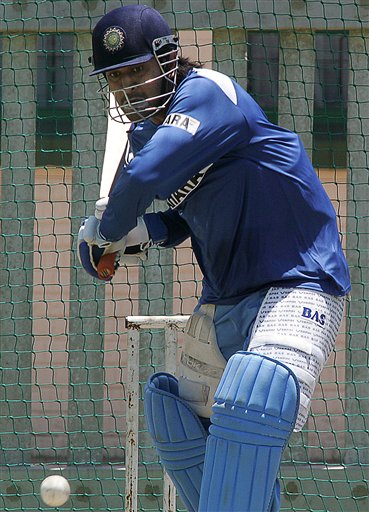 India's cricket player Mahendra Dhoni, bats during the net practice in Benoni, South Africa. India gears up for SA