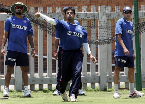 India's cricket captain Rahul Dravid, center, throws the ball as teammates Harbhajan Singh, left, and Ajit Agarkar, right, look on during their practice in Benoni, South Africa. India gears up for SA