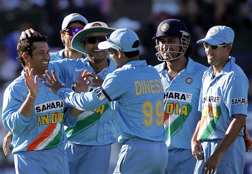 India's bowler Sachin Tendulkar, left, celebrates with teammates after dismissing South Africa's batsman Justin Kemp, unseen, during the fourth match one-day series against South Africa at Port Elizabeth on Wednesday. 4th ODI: Ind vs SA