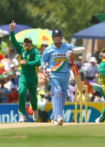 Indian Captain Virenda Sehwag walks back to the pavillion while South African Captain Graeme Smith celebrates the fall of the first wicket of the final ODI at Supersport Park, Centurion on Sunday. 5th ODI: Ind vs SA