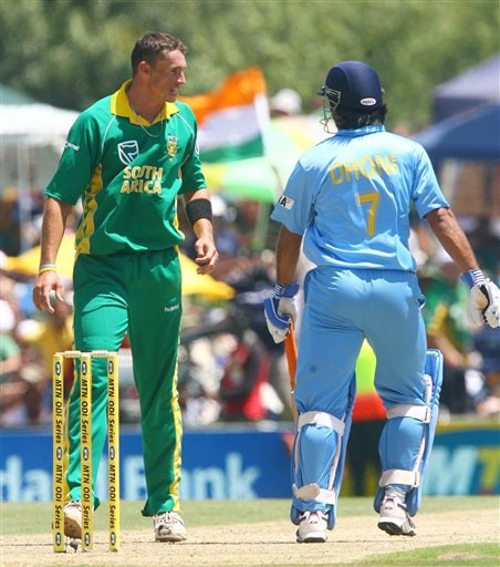 Indian batsman Mahendra Singh Dhoni converses with South African bowler Andre Nel during the final ODI at Supersport Park, Centurion on Sunday. 5th ODI: Ind vs SA