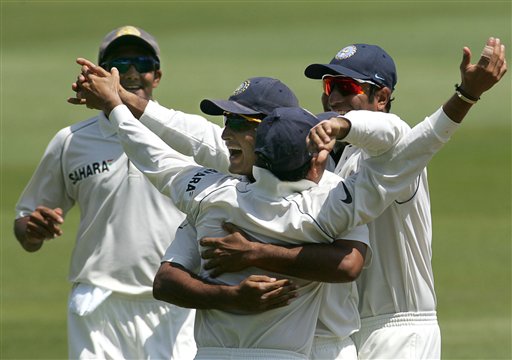 India's Sachin Tendulkar, center, celebrates with teammates Anil Kumble, left, Sourav Ganguly, center background facing camera, and VVS Laxman, right, after making a catch to dismiss South Africa's batsman Graeme Smith, unseen, for 5 runs on the first day of the 2nd Cricket Test match against South Africa at Kingsmead stadium in Durban. Ind-SA 2nd Test Day 1