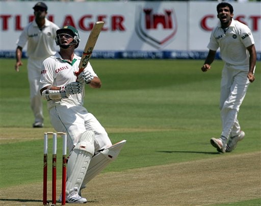 South Africa's batsman Graeme Smith, center, looks up as his caught by India's Sachin Tendulkar, unseen, whilst teammates captain Rahul Dravid, left, and bowler Zaheer Khan, reacts on the first day of the 2nd Cricket Test match against India at Kingsmead stadium in Durban. Ind-SA 2nd Test Day 1