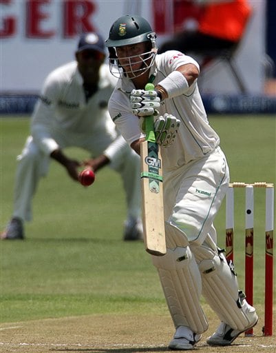 South Africa's batsman Herschelle Gibbs, right, plays a shot as India's fielder VVS Laxman, left, looks on during the first day of the 2nd Cricket Test match against India at Kingsmead stadium in Durban. Ind-SA 2nd Test Day 1