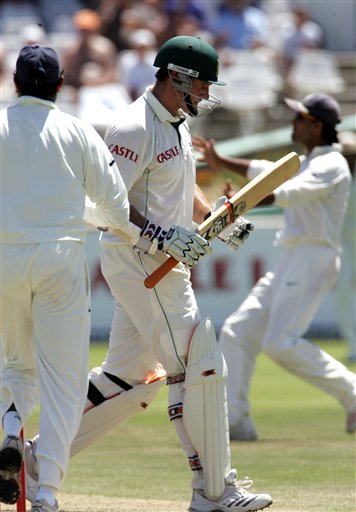 South Africa's batsman Graeme Smith leaves the crease after after his dismissal by India's bowler Anil Kumble, unseen, on the third day of the 3rd and final Test match against India at Newlands stadium in Cape Town, South Africa, Thursday. Ind-SA 3rd Test Day 3
