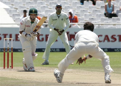 South Africa's batsman Ashwell Prince, left, looks on as India's bowler Shanthakumaran Sreesanth, right, fields off his own bowling whilst teammate VVS Laxman, center, watches on the third day of the 3rd and final Test match against India at Newlands stadium in Cape Town, South Africa, Thursday. Ind-SA 3rd Test Day 3