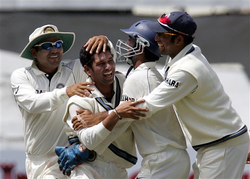 India's bowler Sachin Tendulkar, second from left, celebrates with teammates Virender Sehwag, left, wicketkeeper Dinesh Karthik, second from right, and VVS Laxman, right, after dismissing South Africa's batsman Jacques Kallis, unseen, for 54 on the third day of the 3rd and final Test match against South Africa at Newlands stadium in Cape Town, South Africa, Thursday. Ind-SA 3rd Test Day 3