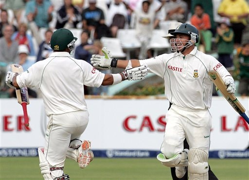 South Africa's batsman Ashwell Prince, left, celebrates with teammate Herschelle Gibbs, right, as he scores the winning runs on the final day of the 3rd and final Test match against India at Newlands stadium in Cape Town Ind-SA 3rd Test Day 5