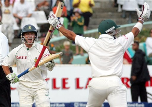 South Africa's batsman Ashwell Prince, right, celebrates with teammate Herschelle Gibbs, as he scores the winning runs on the final day of the 3rd and final Test match against India at Newlands stadium in Cape Town Ind-SA 3rd Test Day 5