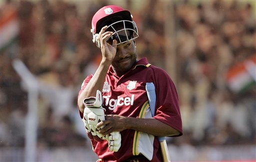 West Indies Brian Lara removes his helmet while leaving the ground after India's Irfan Pathan took his wicket during the fourth one day international cricket match in Vadodara, India. Ind-WI 4th ODI