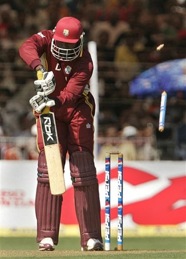 Bails for West Indies Chris Gayle goes off on the delivery of India's Ajit Agarkar during the fourth one day international cricket match in Vadodara, India. Ind-WI 4th ODI