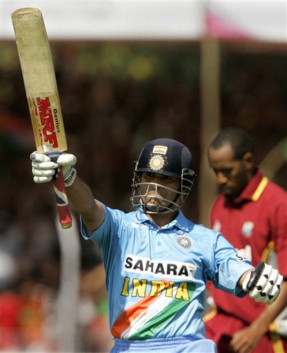 India's Sachin Tendulkar celebrates his century against West Indies during the fourth one day international cricket match in Vadodara, India. Ind-WI 4th ODI