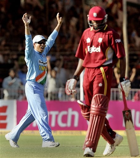 Indian cricketer Sachin Tendulkar, left, celebrates after winning the fourth one-day international cricket match against West Indies in Vadodara, India. Ind-WI 4th ODI