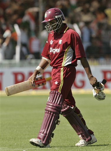 West Indies batsman Shivnaraine Chanderpaul leaves the ground after his dismissal by India's Zaheer Khan during the fourth one day international cricket match in Vadodara, India. Ind-WI 4th ODI