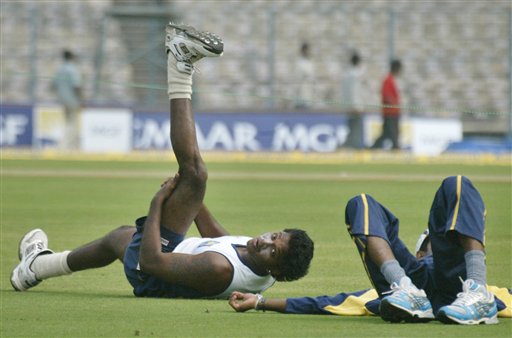 Sri Lanka's Dilhara Fernando, left, stretches during a practice session in Kolkata, India, Wednesday, February 7, 2007. Sri Lanka will play its first one day limited over international cricket match against India Thursday. India, SL gear up
