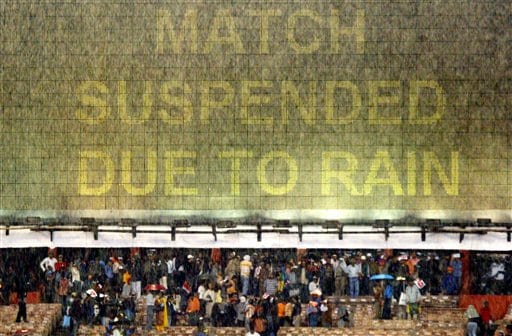 A message flashes on the scoreboard as rain falls over the Eden Gardens stadium during the first one-day international cricket match between India and Sri Lanka in Kolkata on Thursday, February 8, 2007. Ind-SL 1st ODI