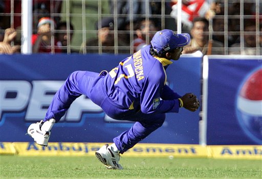 Sri Lankan cricketer Mahela Jayawardene takes a successful catch for the dismissal of India's Harbhajan Singh during the second one-day international in Rajkot, India, Sunday, February 11, 2007. Ind-SL 2nd ODI