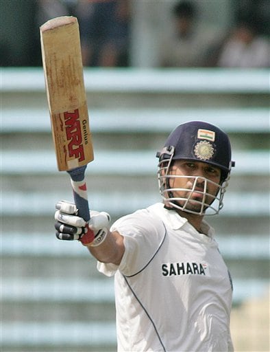 Sachin Tendulkar raises his bat to acknowledge the applause after scoring a century on the second day of the second cricket test match between India and Bangladesh at the Shere Bangla National Stadium in Dhaka, Bangladesh, Saturday, May 26, 2007. Ind v Ban, 2nd Test- Day 2