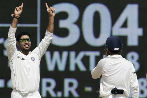 India's Yuvraj Singh celebrates the dismissal of Steve Harmison as Gautam Gambhir runs in to congratulate him during the second day of the first Test between India and England in Chennai on Friday.(AP Photo) India vs England: 1st Test, Day 2