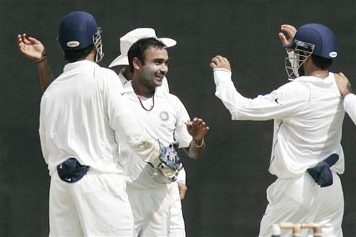 Teammates congratulate bowler Amit Mishra after the dismissal of England's James Anderson during the second day of the first Test match between India and England in Chennai on Friday. (AP Photo) India vs England: 1st Test, Day 2
