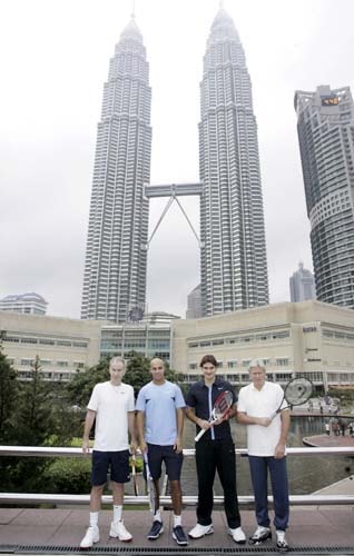 American John McEnroe, American James Blake, Switzerland's Roger Federer, and Swedish Bjorn Borg pose in front of Malaysia's landmark Petronas Twin Towers in Kuala Lumpur, Malaysia on Monday. They visited Malaysia for the Showdown of Champions Kuala Lumpur 2008 exhibition matches on Tuesday. Showdown of champions