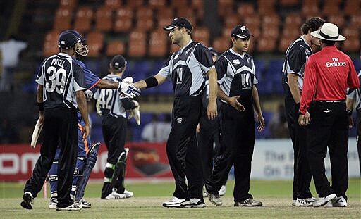New Zealand captain Daniel Vettori shakes hands with Indian captain Mahendra Singh Dhoni, after India beat Kiwis by 6 wickets in the ODI match for the tri-nation series in Colombo on Friday, September 11, 2009. Sri Lanka is the third team in the series. (AP Photo) Tri-series: IND vs NZ