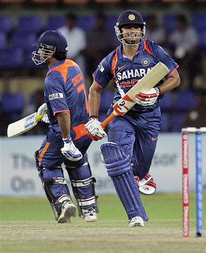 India's Suresh Raina and Mahendra Singh Dhoni complete the winning run to beat New Zealand during their ODI match for the tri-nation series in Colombo on Friday. (AP Photo) Tri-series: IND vs NZ