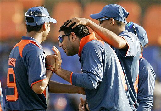 Indian cricketers congratulate teammate Yuvraj Singh after he dismissed New Zealand's Neil Broom during their ODI match for the tri-nation series in Colombo on Friday. (AP Photo) Tri-series: IND vs NZ