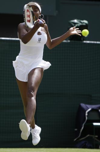 Venus Williams of the US in action during her second round match against Britain's Anne Keothavong at Wimbledon. Wimbledon Day 4