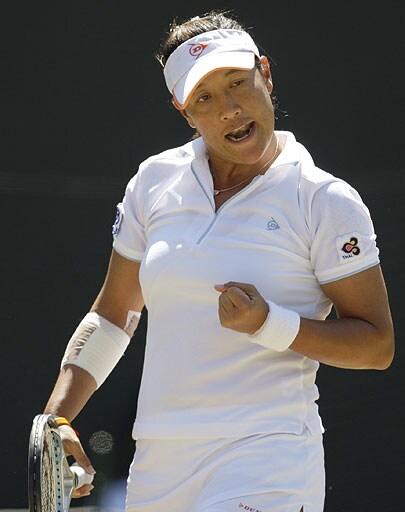 Tamarine Tanasugarn reacts during her Women's Singles quarterfinal against Venus Williams, on the Number One Court at Wimbledon. Wimbledon Day 8