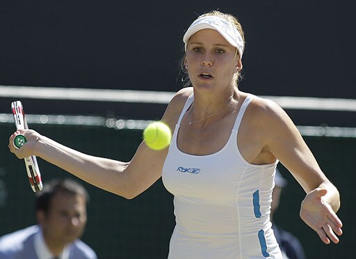 Nicole Vaidisova of the Czech Republic returns to China's Zheng Jie during their Women's singles quarterfinal on the Number One Court at Wimbledon. Wimbledon Day 8