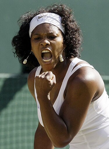 Serena Williams of the US reacts during her quarterfinal match against Poland's Agnieszka Radwanska on the Centre Court at Wimbledon. Wimbledon Day 8