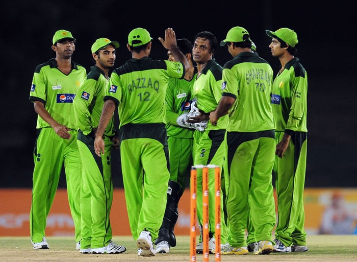 Shoaib Akhtar celebrates with his teammates after he dismissed Junaid Siddique during the fifth ODI of the Asia Cup between Pakistan and Bangladesh at the Rangiri Dambulla International Cricket stadium in Dambulla. (AFP Photo) Asia Cup: Pak vs B'desh