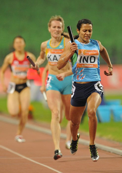 Mandeep Kaur finishes first for team India in the women's 4x400 relay final in the athletics competition at the 16th Asian Games in Guangzhou on November 26, 2010. The Indian team won gold. (AFP Photo)