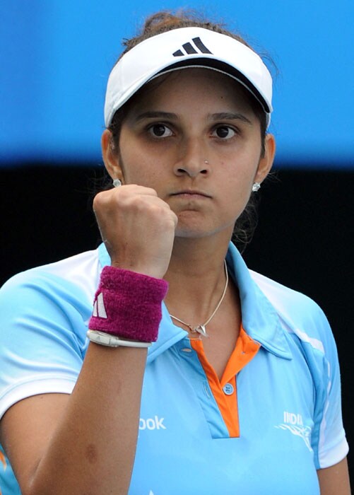 Sania Mirza of India gestures after defeating Zhang Shuai of China in the women's singles second round tennis at the 16th Asian Games in Guangzhou. Mirza won the match in straight sets 6-2, 6-2. (AFP Photo)