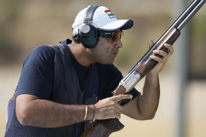 Manavjit Singh Sandhu  of India competes in the men's Trap individual shooting competition during the 16th Asian Games at the Guangzhou shotgun center. (AFP Photo)