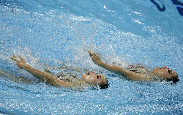 Park Hyunha and Park Hyunsun of South Korea compete during the synchronised swimming competition at the 16th Asian Games in Guangzhou. The Chinese duet won gold, the Japanese silver and South Korean bronze. (AFP Photo)