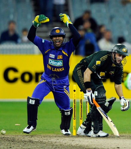 Kumar Sangakkara, left, from Sri Lanka celebrates after teammate Chamara Kapugedera bowls Michael Hussey out during one-day international cricket match against Australia at the Melbourne Cricket Ground on Friday, February 29, 2008. 12th match - Australia vs Sri Lanka