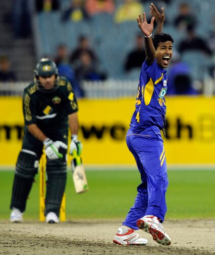 Nuwan Kulasekara from Sri Lanka, right, celebrates the wicket of Ricky Ponting during their one-day international cricket match against Australia at the Melbourne Cricket Ground on Friday, February 29, 2008. 12th match - Australia vs Sri Lanka
