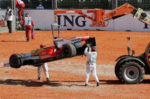 Track marshals clear Force India Formula One driver Giancarlo Fisichella of Italy's car after he crashed at turn one soon after the start of the Australian Grand Prix at the Albert Park circuit in Melbourne on Sunday, March 16, 2008. F 1: Australian Grand Prix