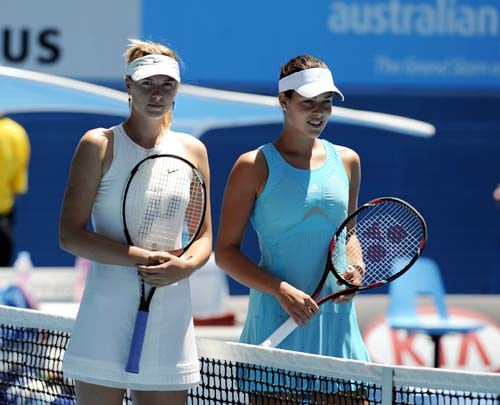 Serbia's Ana Ivanovic, right, and Russia's Maria Sharapova pose for a photo at the net before the start of the final of the Women's singles at the Australian Open tennis tournament in Melbourne on Saturday, January 26, 2008. Day 13: Australian Open