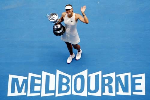 Russia's Maria Sharapova holds a trophy after beating Serbia's Ana Ivanovic during the final of the Women's singles at the Australian Open tennis tournament in Melbourne on Saturday, January 26, 2008. Day 13: Australian Open