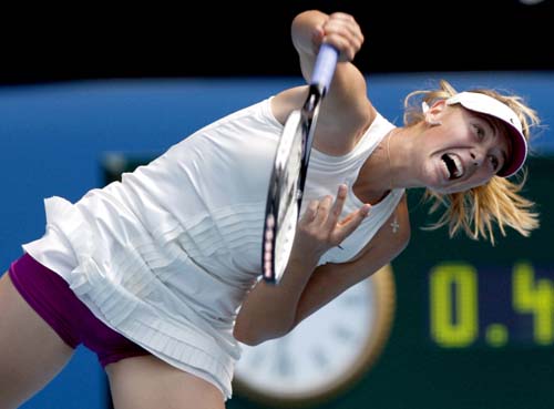 Russia's Maria Sharapova serves to Serbia's Ana Ivanovic during the final of the Women's singles at the Australian Open tennis tournament in Melbourne on Saturday, January 26, 2008. Day 13: Australian Open