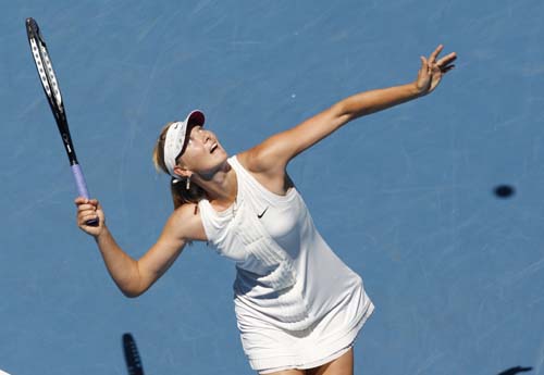 Russia's Maria Sharapova serves to Serbia's Ana Ivanovic during the final of the Women's singles at the Australian Open tennis tournament in Melbourne on Saturday, January 26, 2008. Day 13: Australian Open