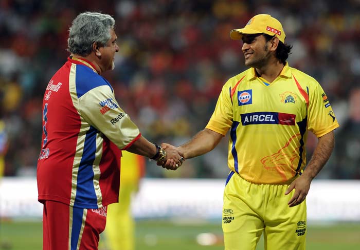 Match 34 of IPL 5 between Royal Challengers Bangalore and Chennai Super Kings at Bangalore was abandoned due to rain. Bangalore owner Vijay Mallya and Chennai's skipper MS Dhoni are seen sharing a light moment.(AFP PHOTO/Manjunath KIRAN) IPL: Another day, another washout as Bangalore, Chennai share points