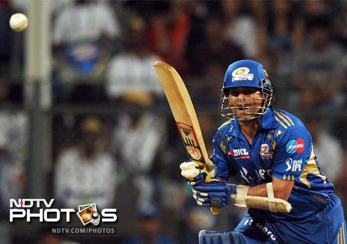 Sachin Tendulkar looked in good touch and scored a watchful 24 off 27 balls. (AFP PHOTO/Indranil MUKHERJEE) IPL 5: Bangalore clobber Mumbai by 9 wickets