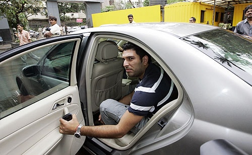 Yuvraj Singh leaves the head office of the BCCI after the meeting in Mumbai. India's cricket board on Sunday rejected WADA's rule that requires details about the location of players three months in advance, allowing random out-of-competition testing. (AP Photo) BCCI backs players on WADA rule