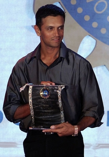 Rahul Dravid holds a commemorative plaque presented to him for taking the highest number of catches at the BCCI annual award function in Mumbai. (AFP Photo) BCCI honours Sachin for cricketing excellence